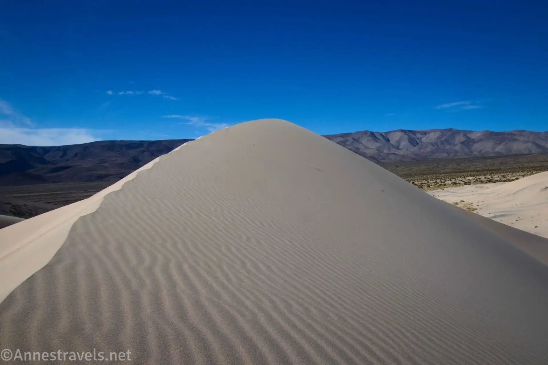 Highest Dune Ripples on the crest of a sand dune with distant mountains visible