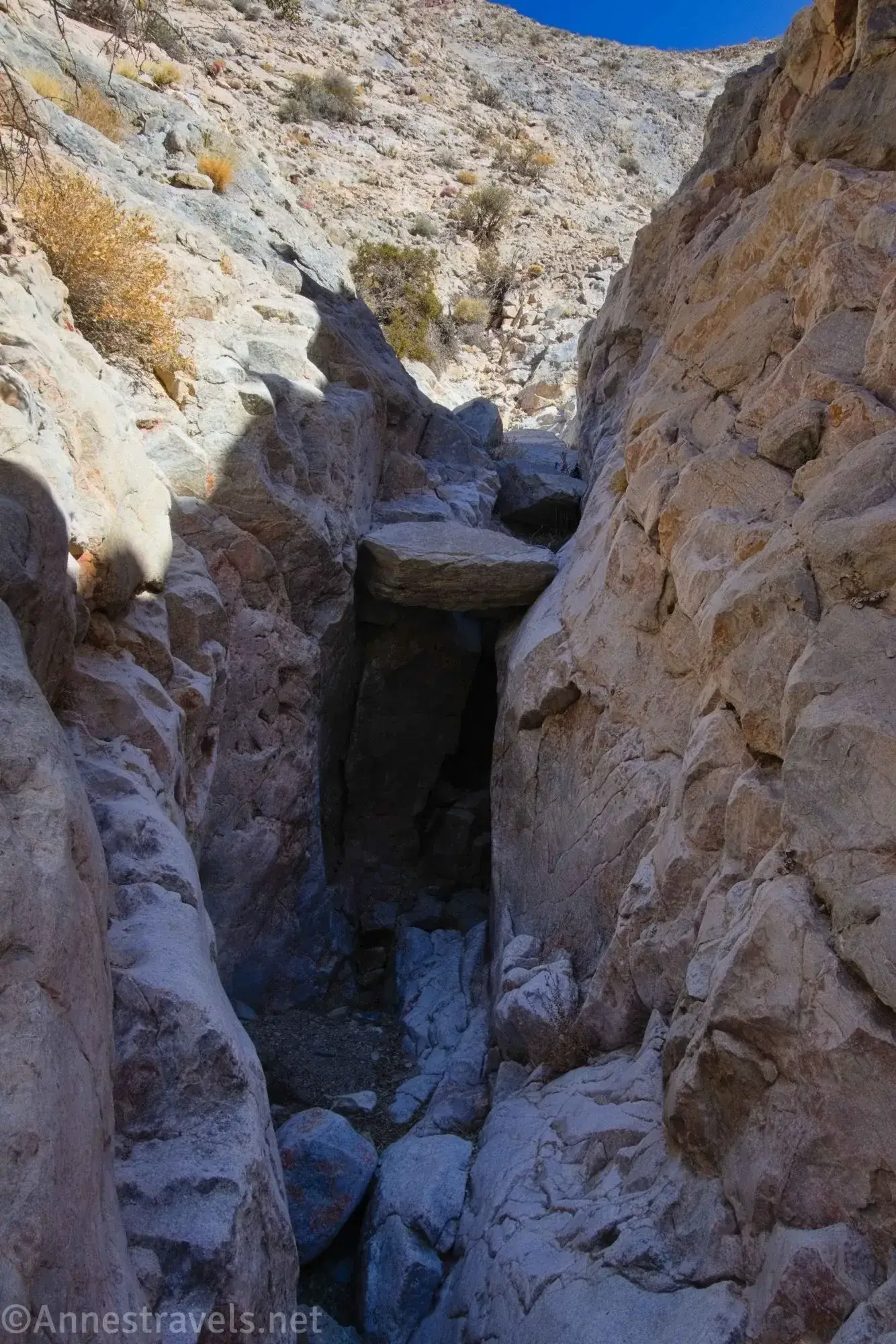 Chokestone in a narrow gorge A chokestone in a desert gorge