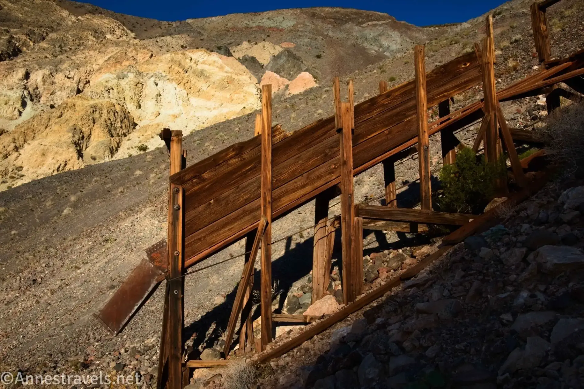 Old Ore Chute A wooden ore chute in front of a rugged desert hillside