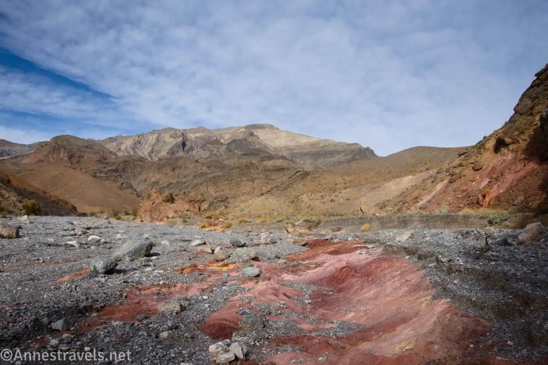 Mount Palmer Red clay and gravel in a wash with views to Mount Palmer