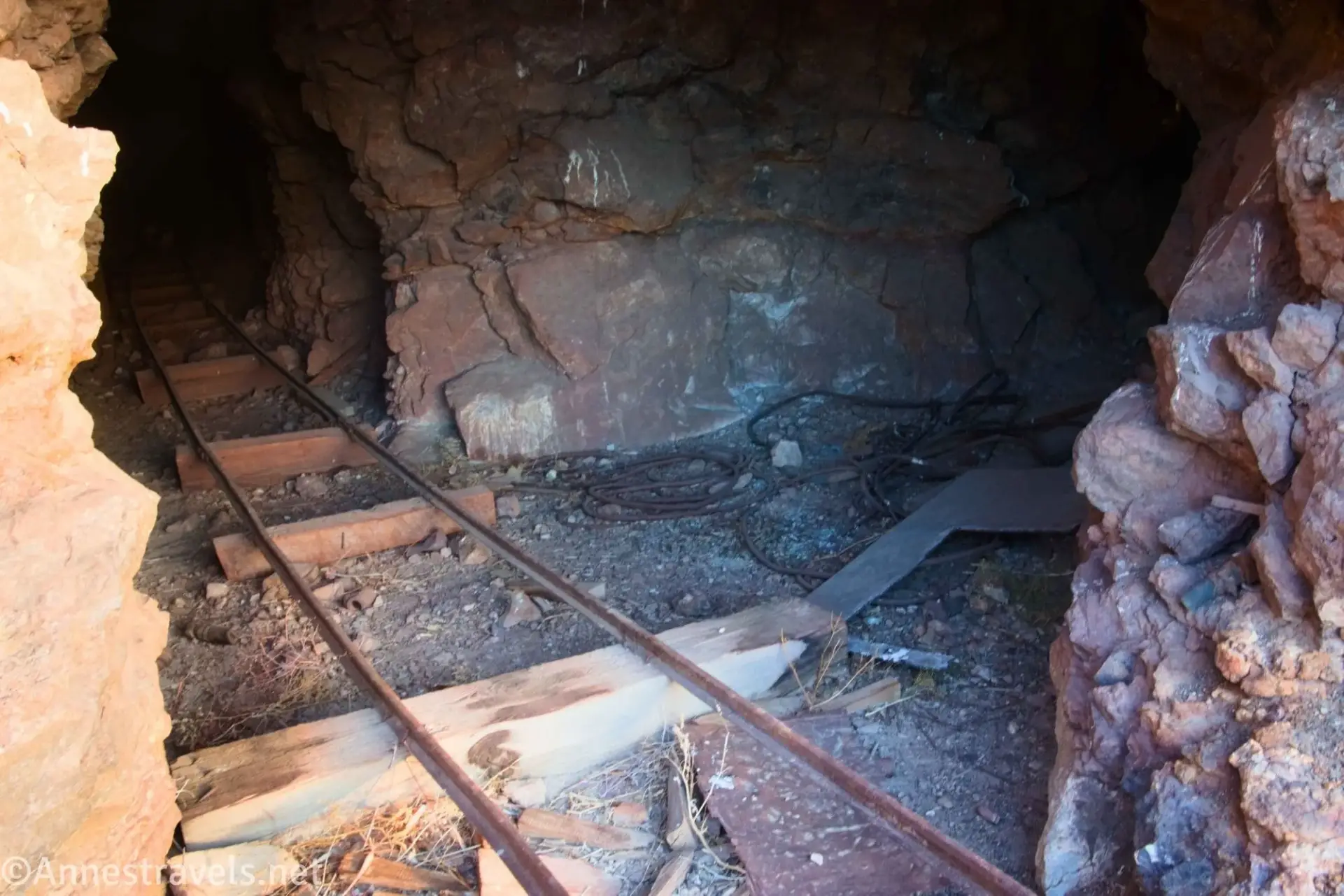 Mine Entrance Railroad track disappear into a rocky mine entrance