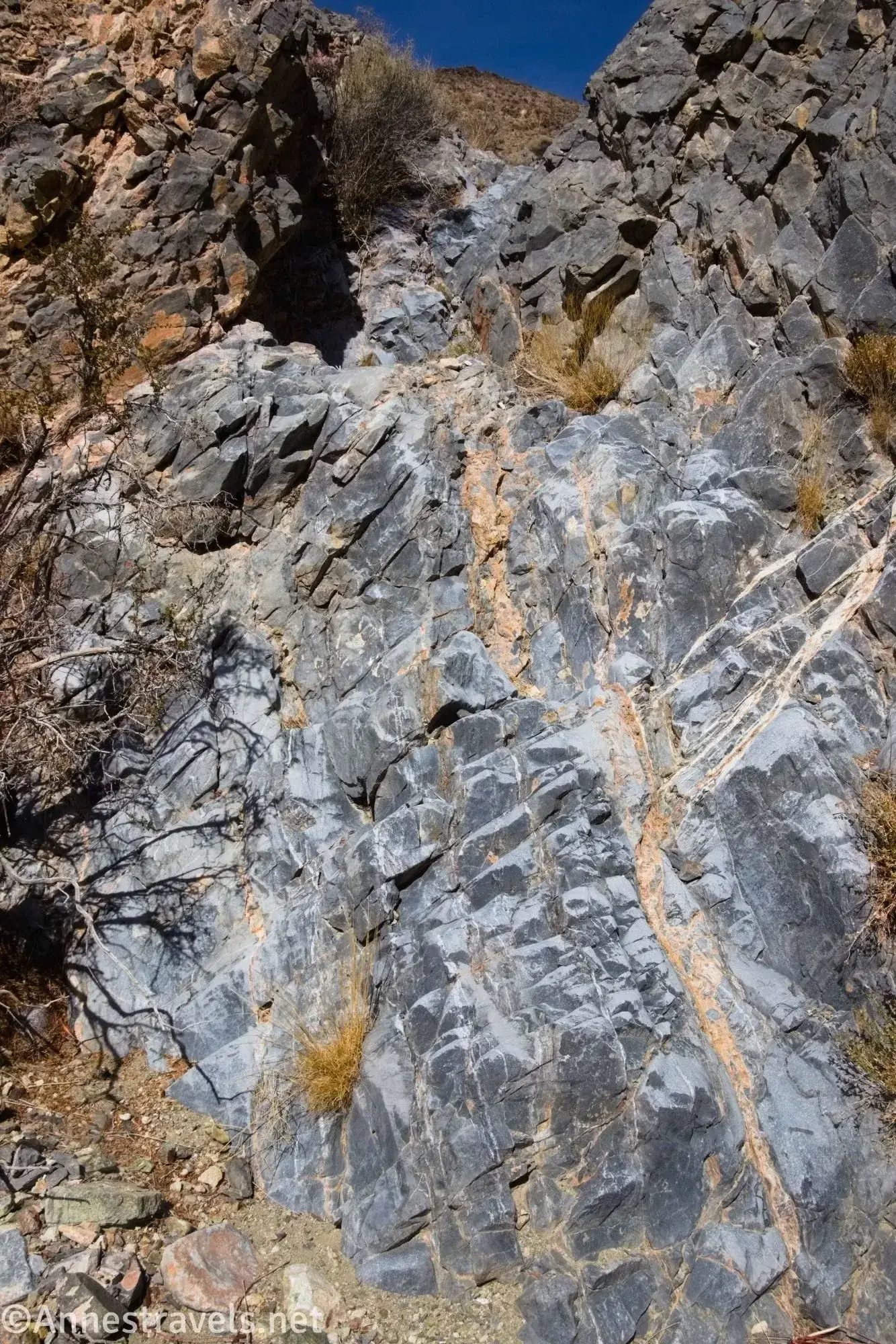 Dryfall in the Upper Canyon Gray and orange rock cliff