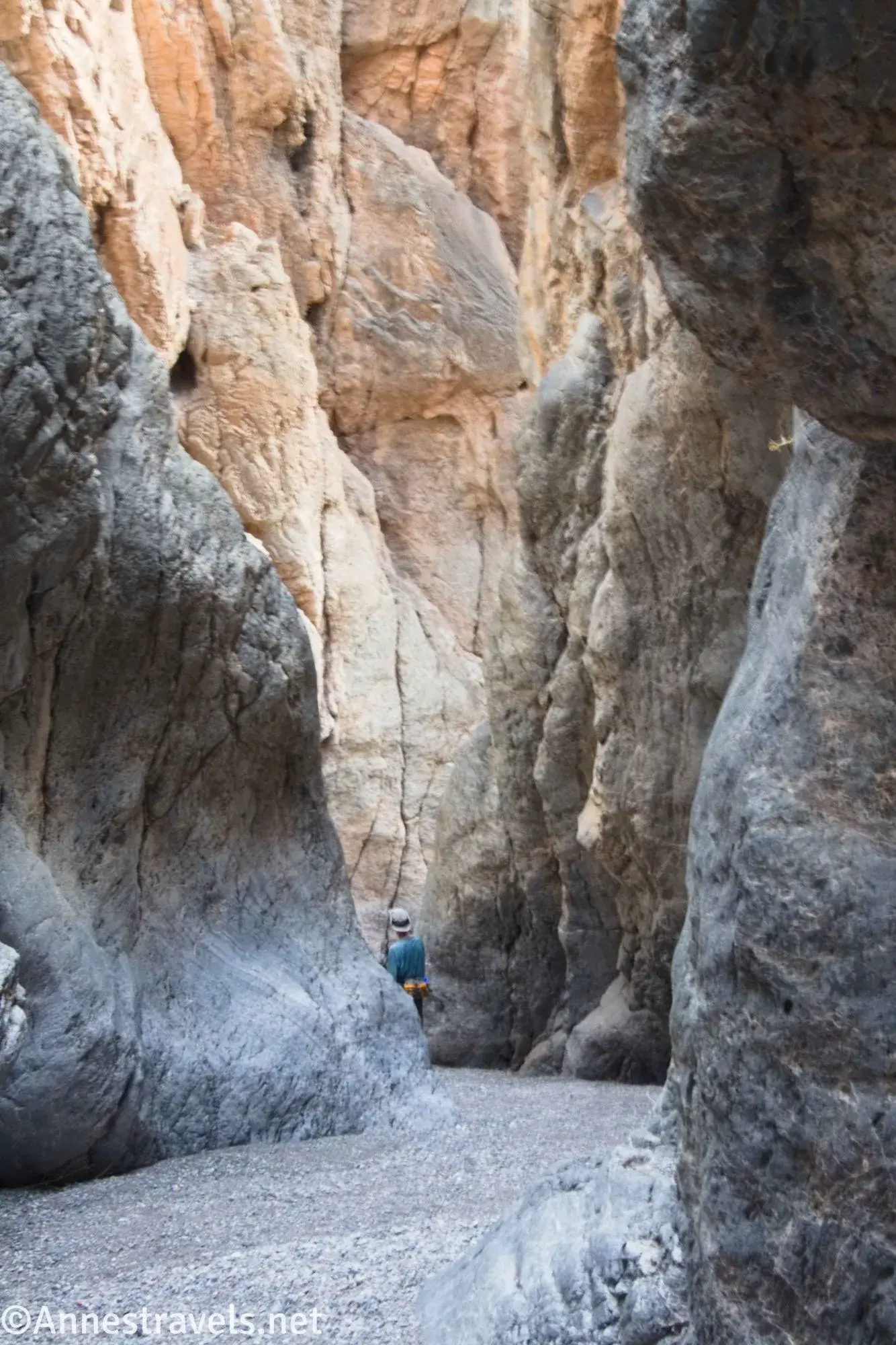 Walls in Palmer Canyon A hiker in a narrow, tall canyon