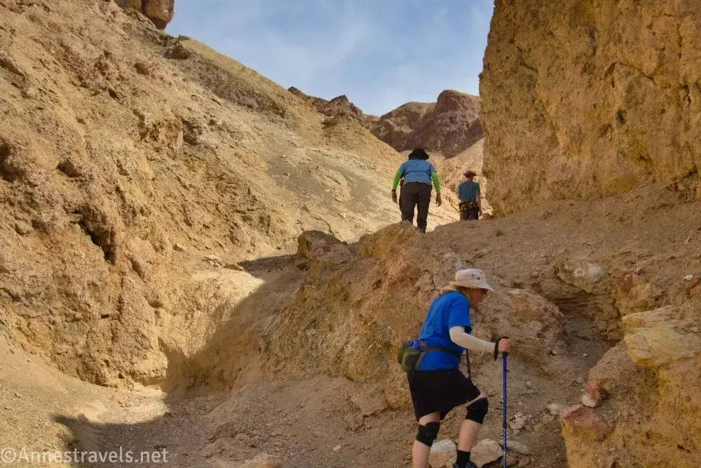 South Fork of Desolation Canyon Wash Three hikers in a yellow canyon