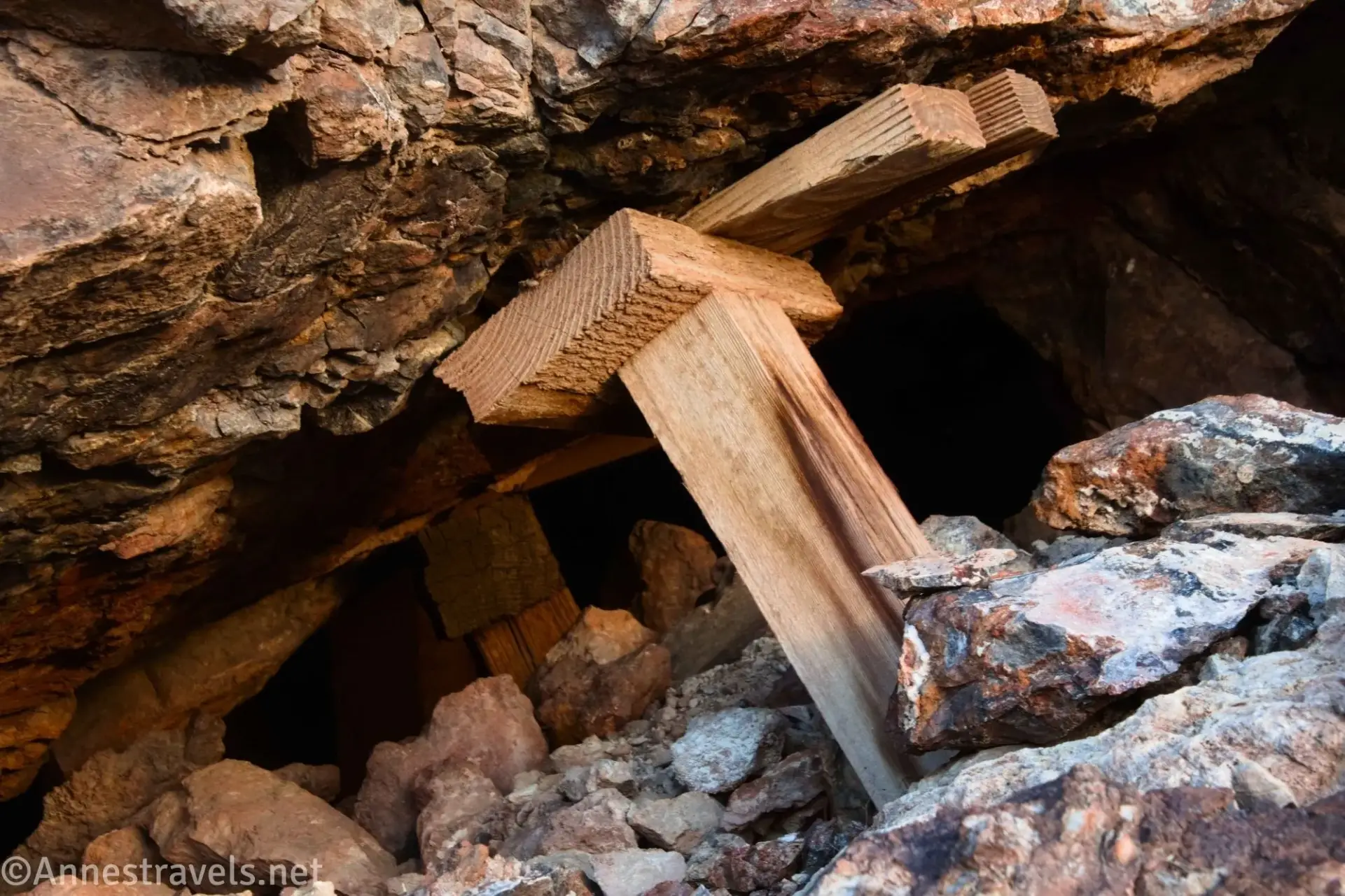 Mine Supports Wooden supports holding up the roof of a rocky mine audit