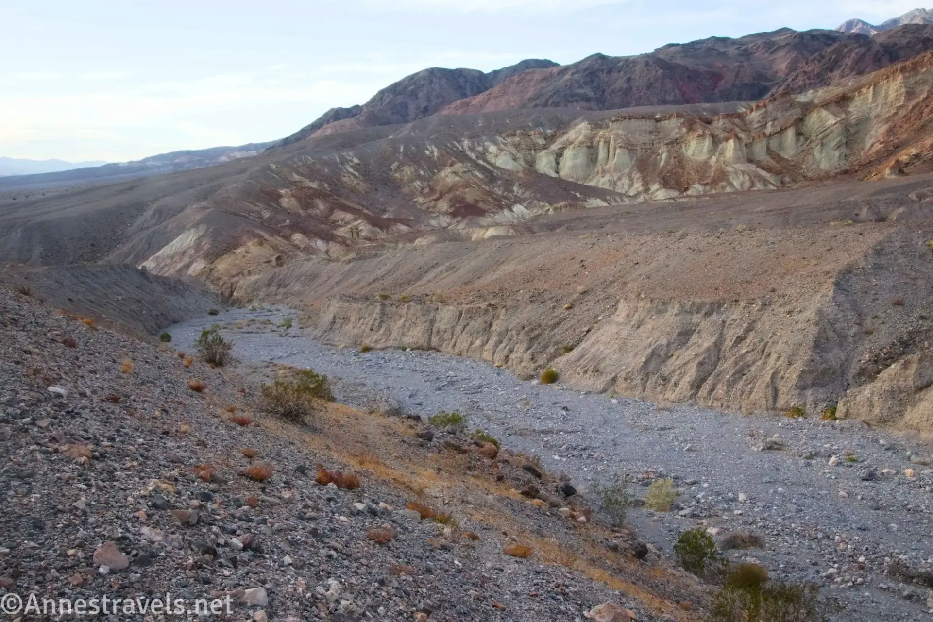 Wash above the Cauldron Colorful badlands beyond a gravel wash
