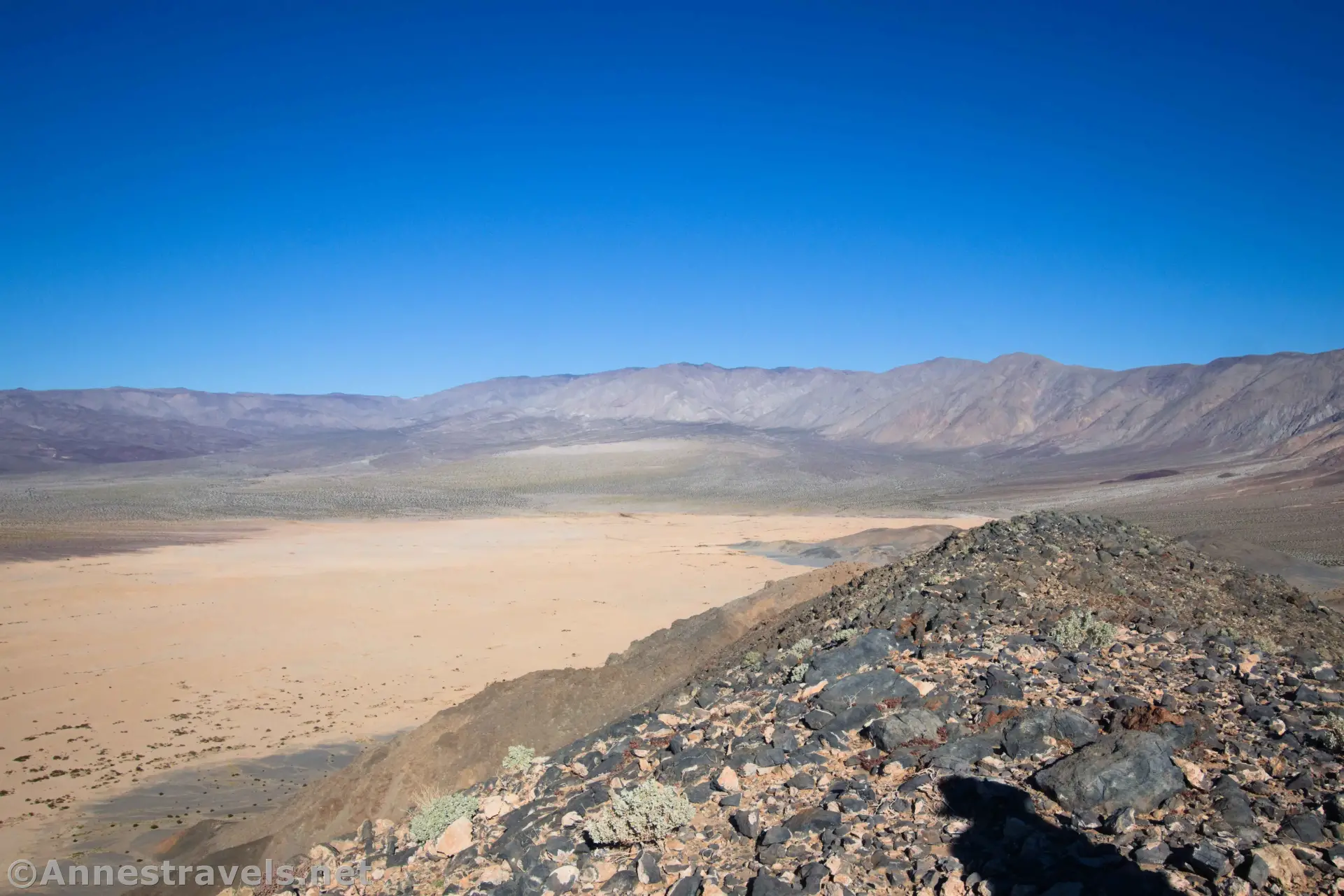 Views South from Lake Hill A rocky ridgeline with playa down in the valley and mountains at the end of the valley