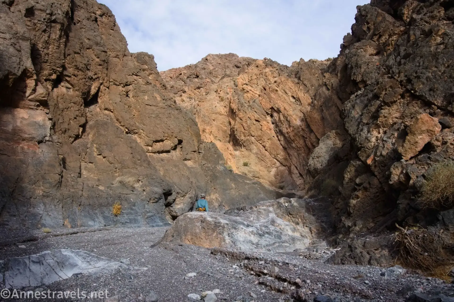 Hiking Up Palmer Canyon A hiker in a rugged desert canyon