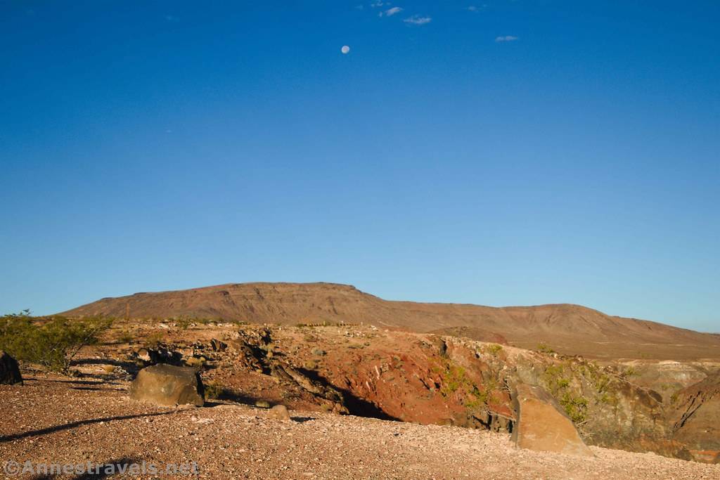 The moon over a desert landscape