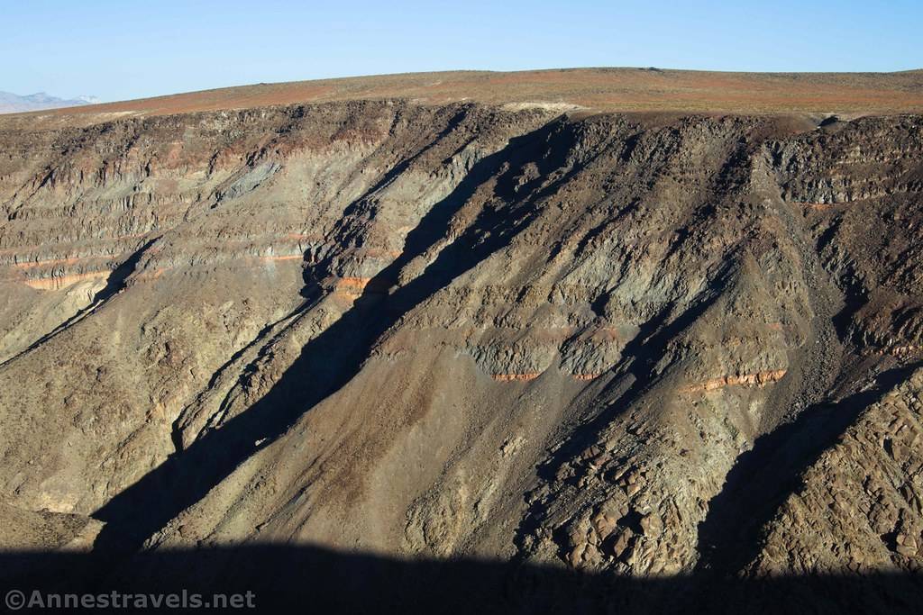 Layers of rock in in the side of a desert canyon