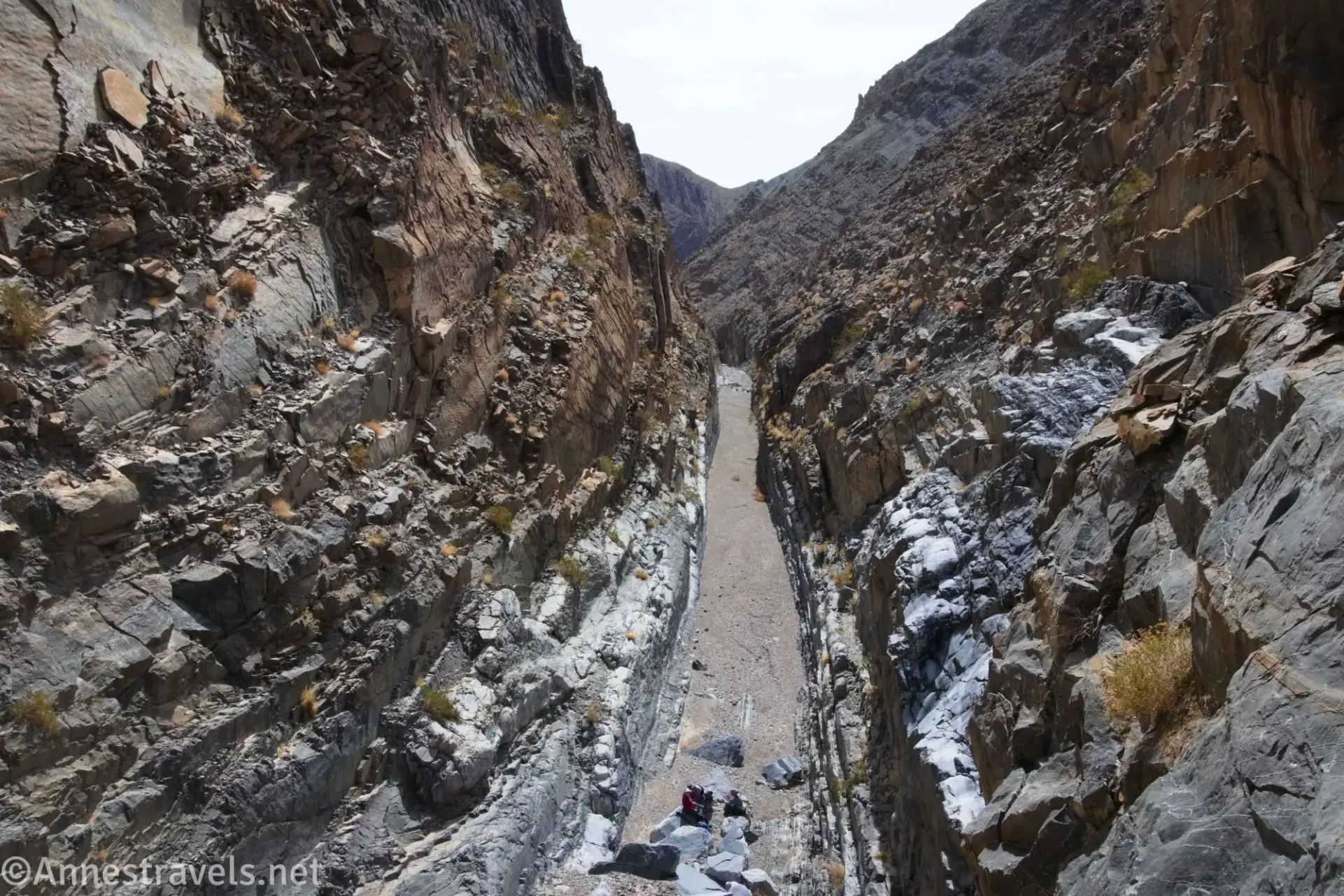 A long and straight canyon with rocky walls