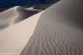 Dune Ridgeline Ripples along the crest of a sand dune with another dune in the distance