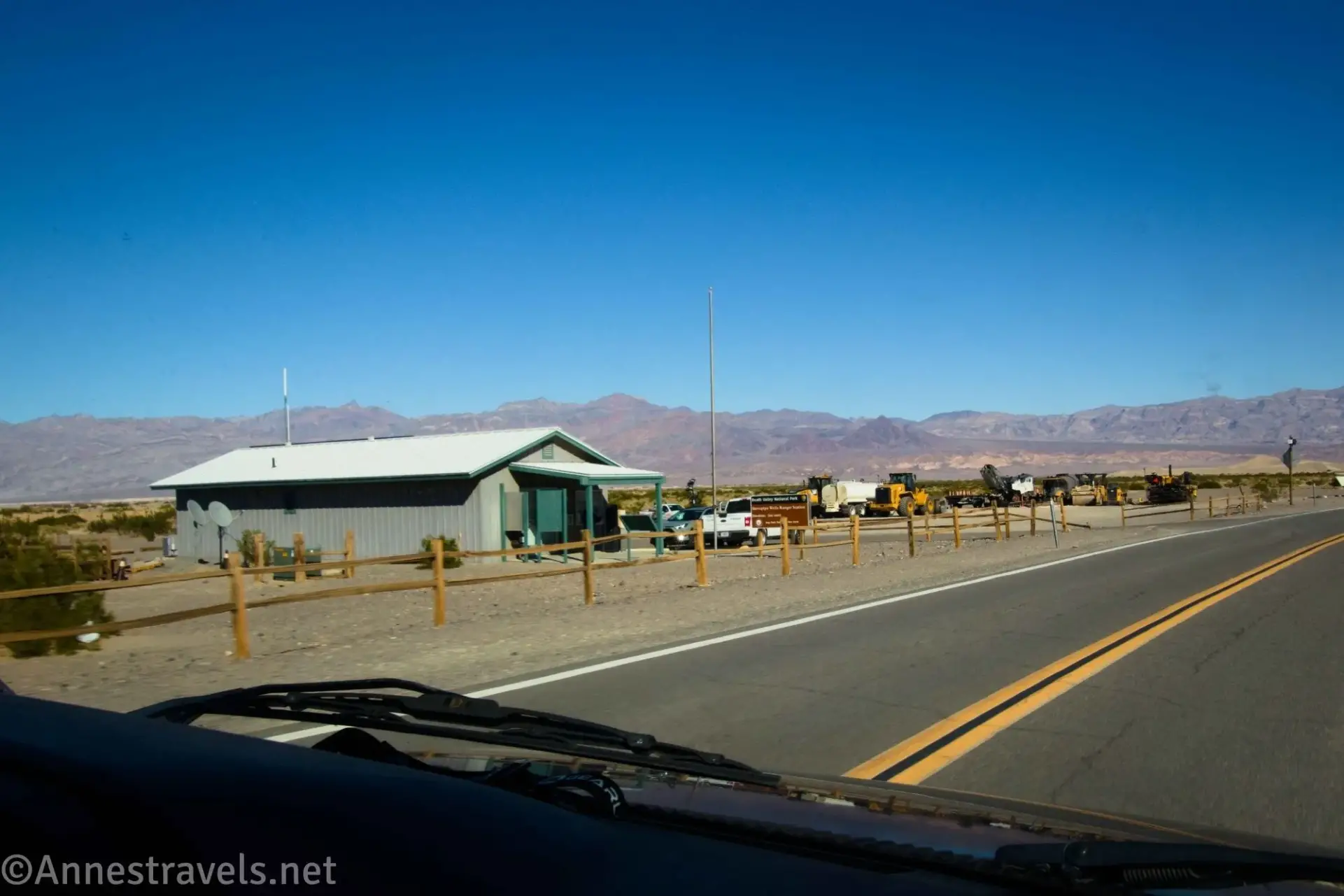 Small building and split rail fence in the desert