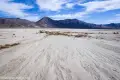 Racetrack Playa near the Grandstand Salt flats of the Racetrack Playa with the Last Chance Mountains and clouds beyond