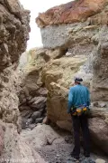 Best Slot Fork A hiker in a rock-filled slot canyon