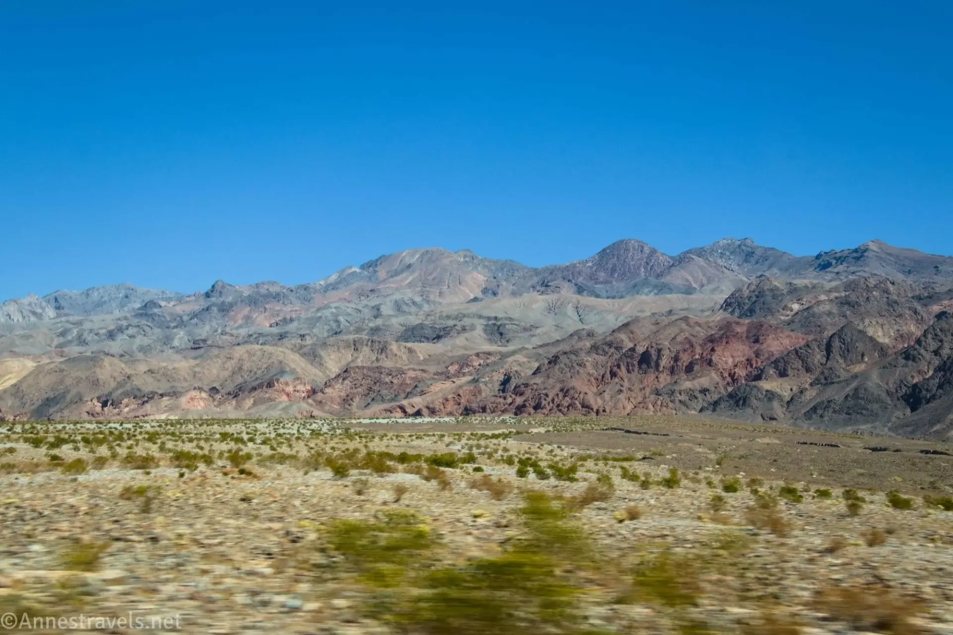 Views across a desert plain to Red Wall Canyon
