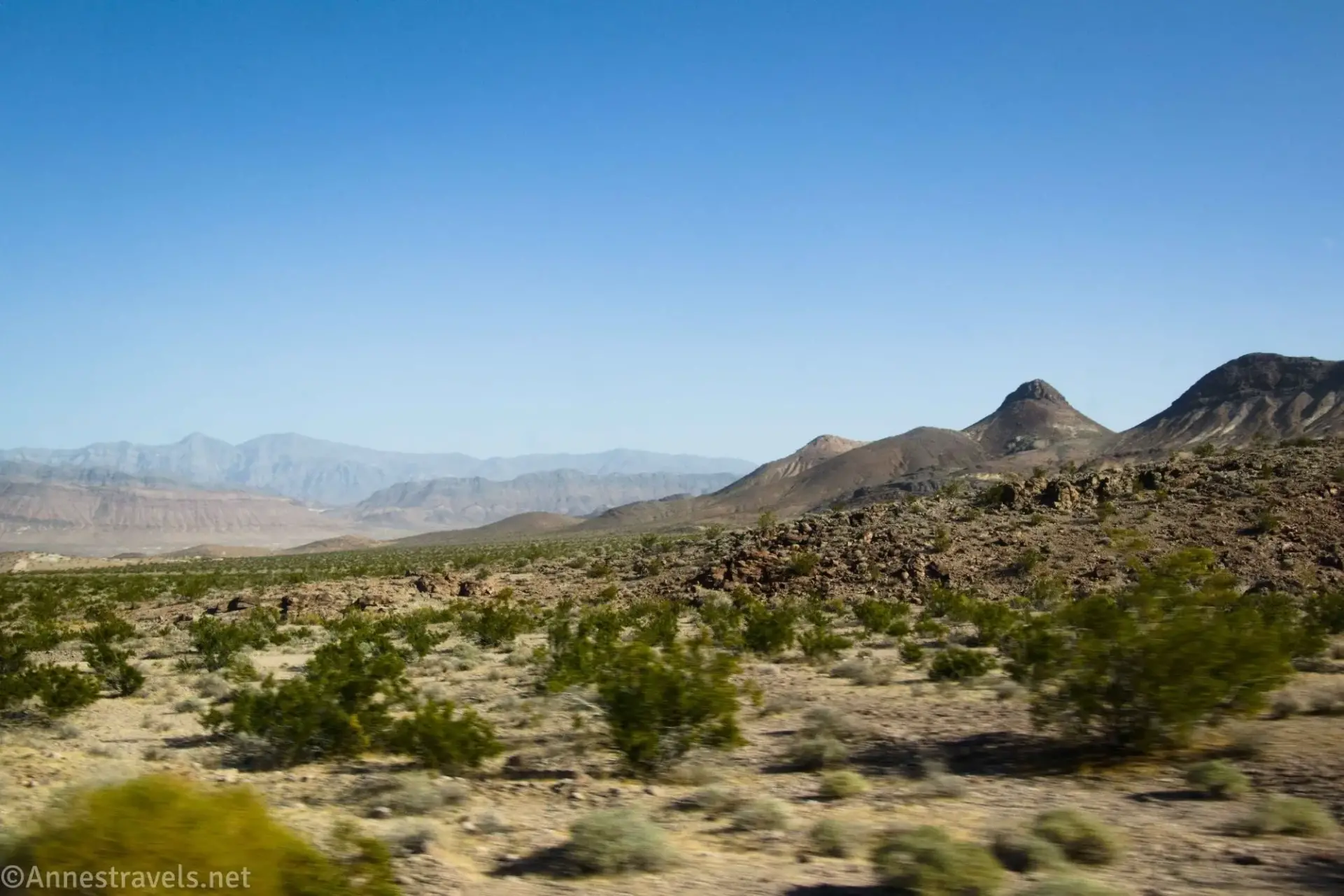 Desert mountains across a brushy plain