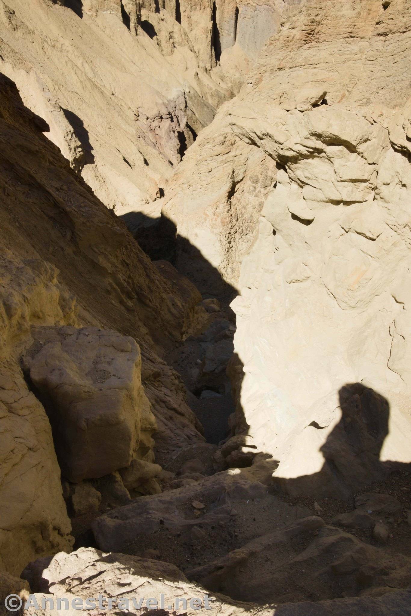At the top of the sketchy dryfall in 20 Mule Team Canyon, Death Valley National Park, California