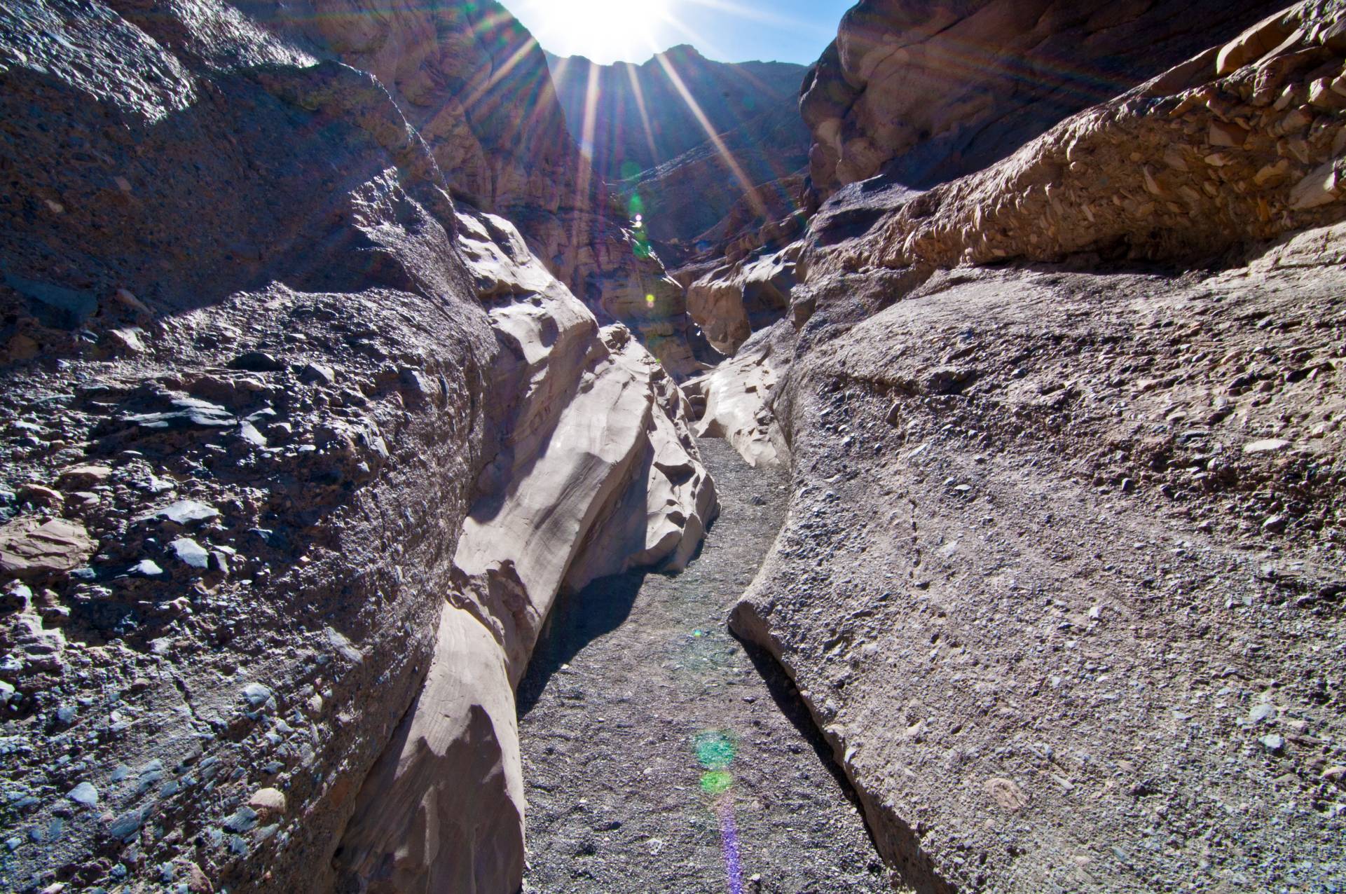Pebbly canyon walls and a sunstar
