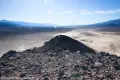 Views South from Lake Hill A rocky hilltop gives way to views of playa and distant hazy mountains