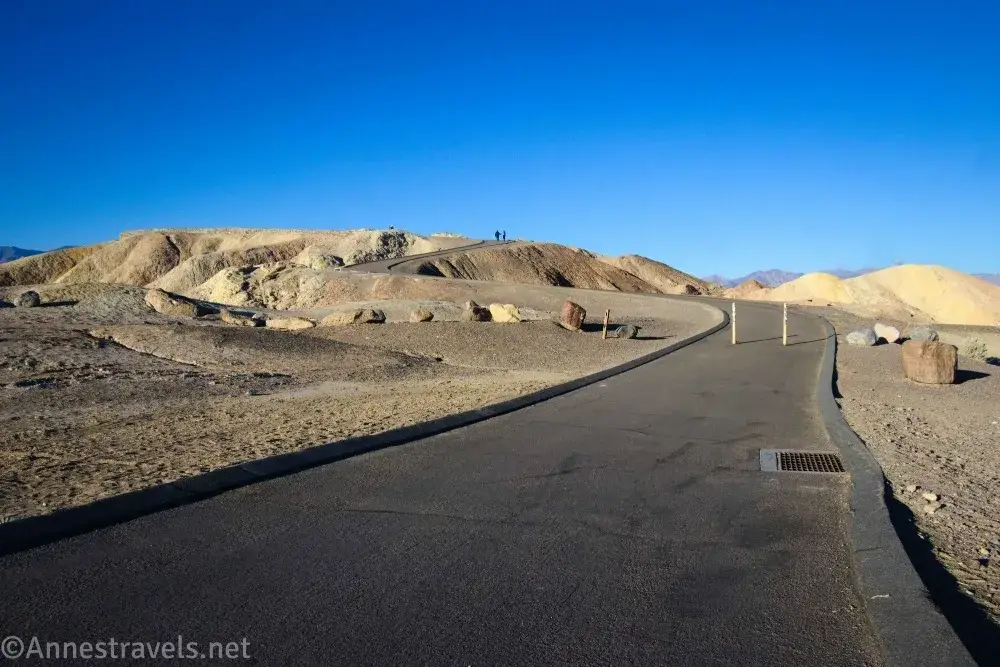 Wide paved path leading to the top of a badland hill known asZabriskie Point, Death Valley National Park, California