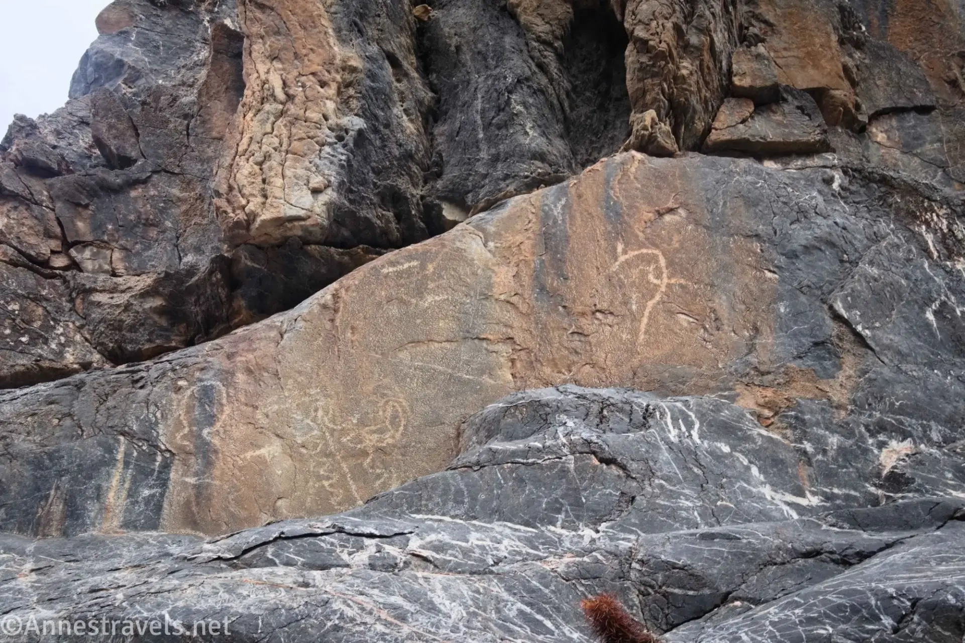 Rock art on gray and brown rock