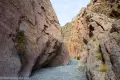 Short but Narrow Canyon Rock walls create a short but narrow canyon above a gravel wash