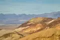 Colorful hills north of Desolation Canyon Colorful hills in front of gray mountains
