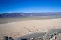 Views Southwest from Lake Hill Playa stretches to yellow desert plains and a distant ridgeline