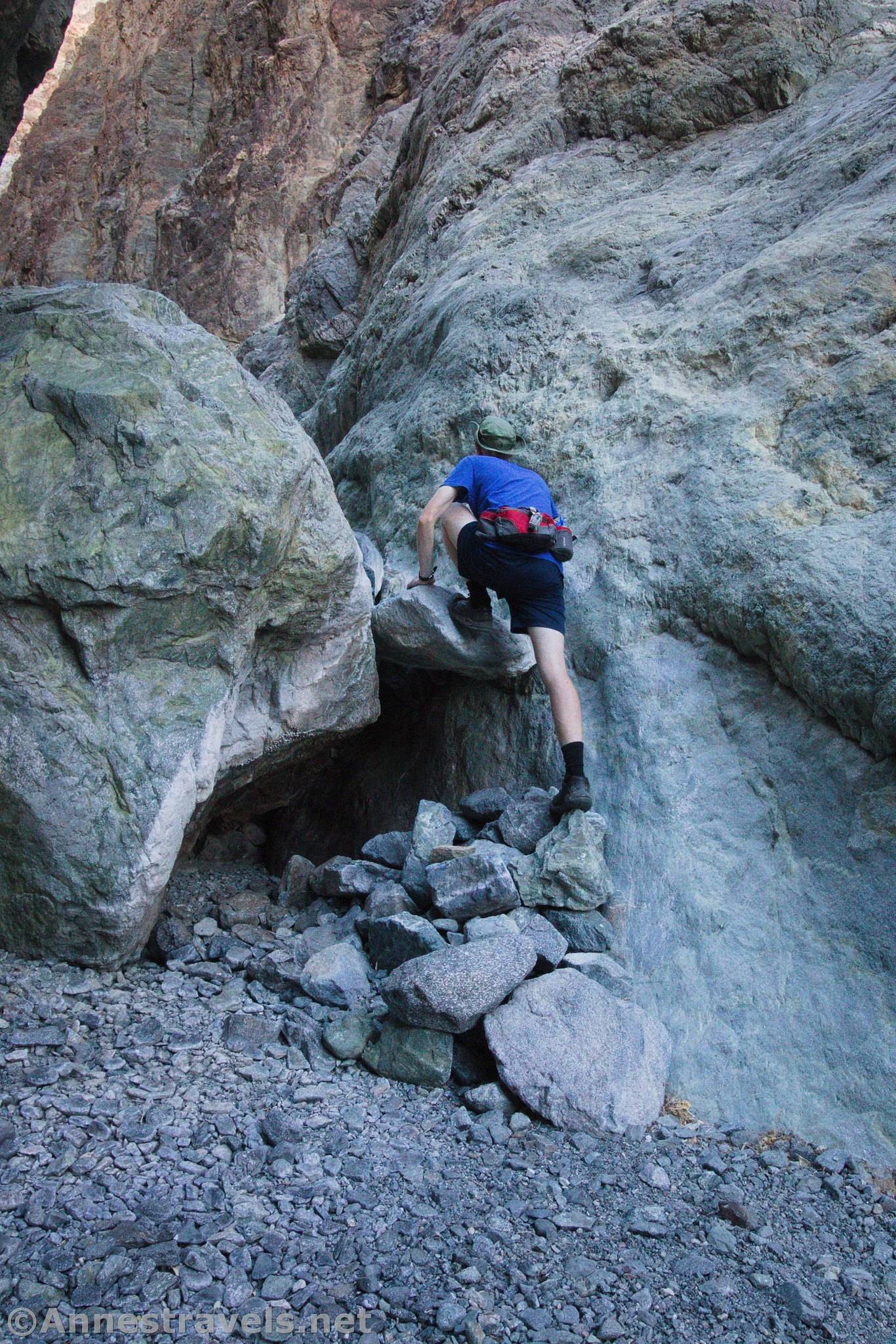 Scrambling up a dryfall in Willow Canyon, Death Valley National Park, California