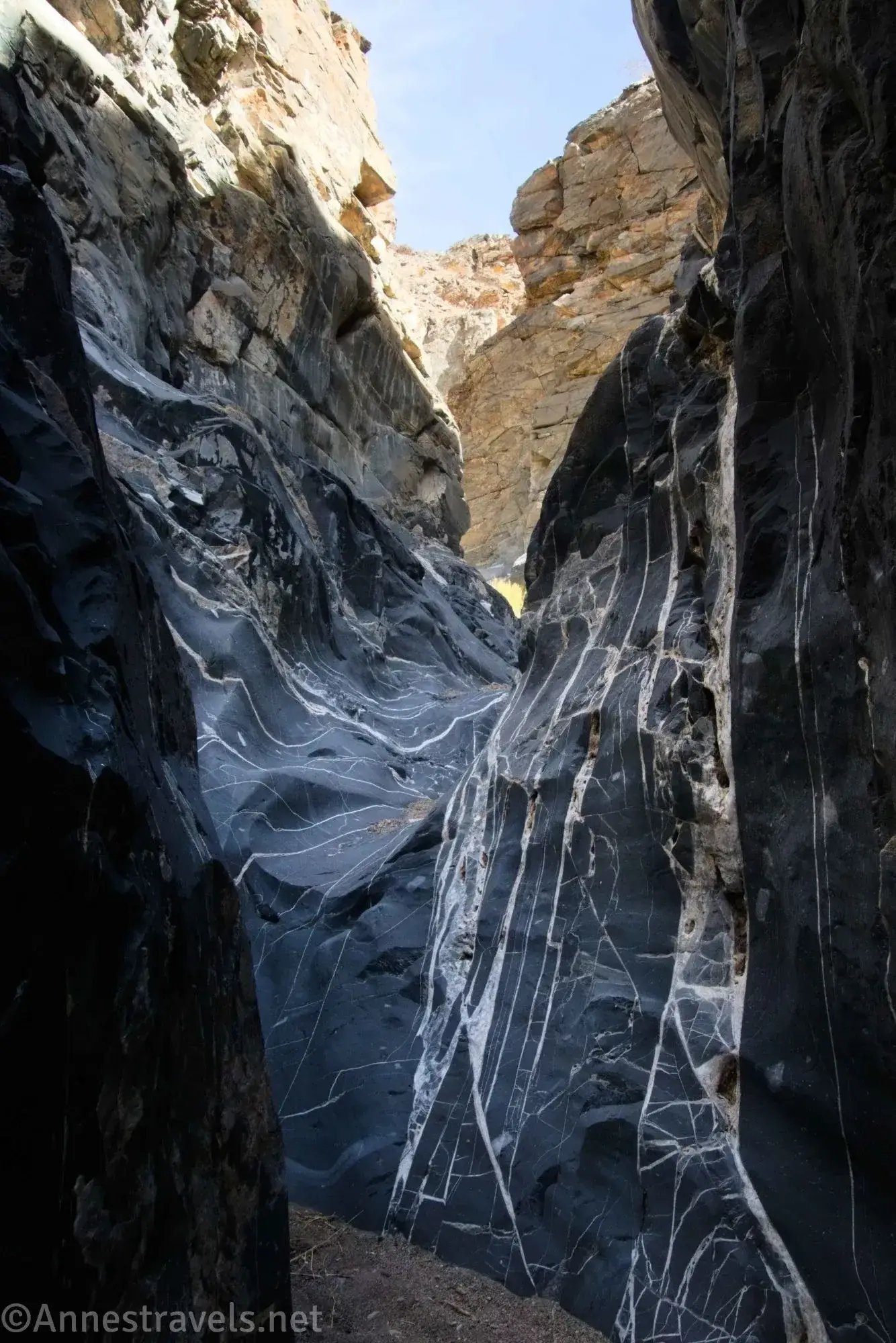 White stripes in black rock dryfall