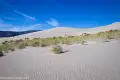 Approaching Panamint Dunes Rippled sand leads to brush at the base of sand dunes